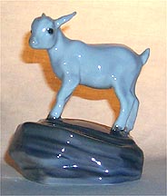 Royal Copenhagen Figurine - Kid On Stone