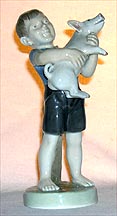 Royal Copenhagen Figurine - August, Boy With Piglet
