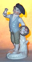 Colonial Boy With Basket Of Flowers Figurine
